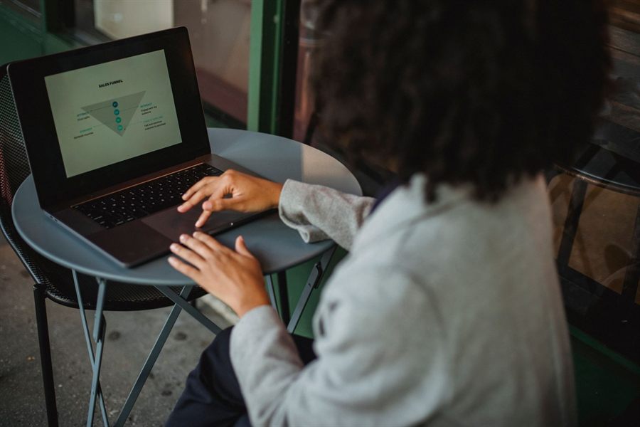 Woman typing on a laptop