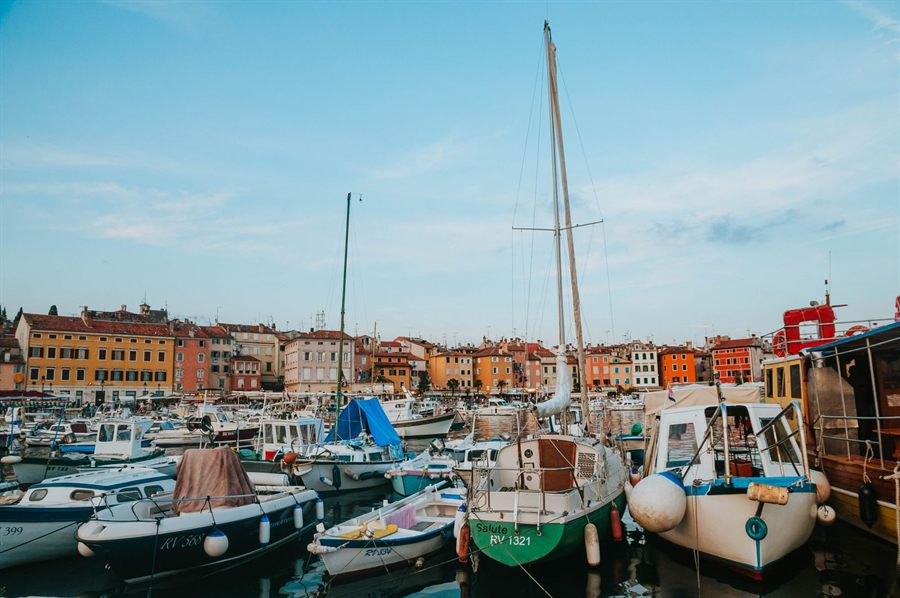 Colorful harbor town with boats moored
